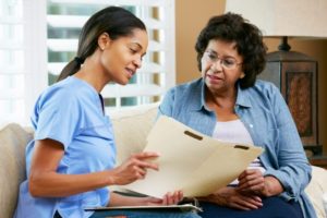 A nurse explaining a document to a patient