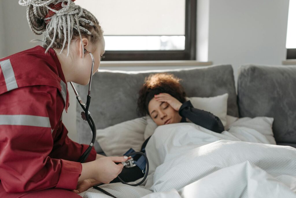 A woman with an IVIG headache getting checked