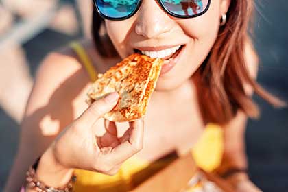 Woman eating crunchy food