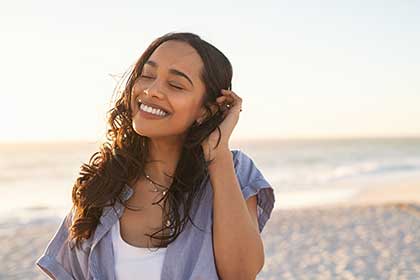 Smiling woman with improved CIDP symptoms after IVIG