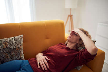 Woman with headache as a side effect of Emend