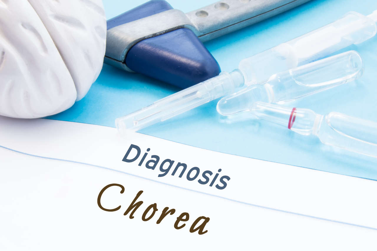 Neurological hammer, brain shape, syringe with needle and vials of medicines are next to inscription Diagnosis Chorea.