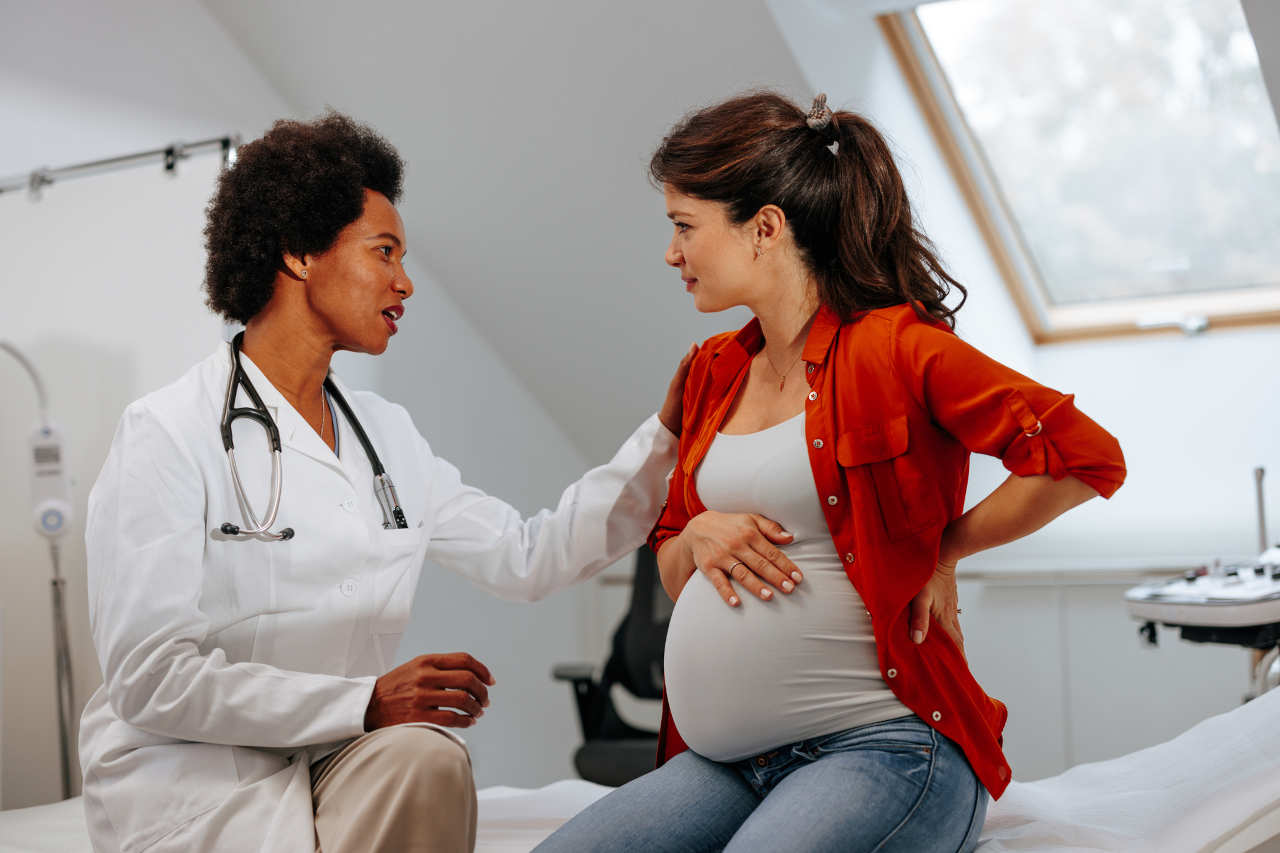 Doctor advising pregnant woman