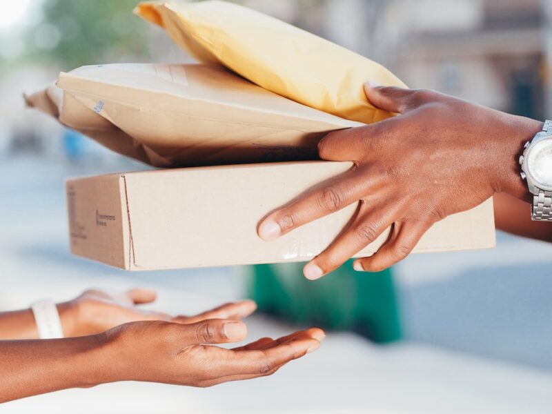 A person handing over packages