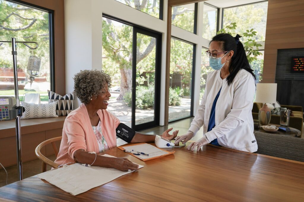 A nurse conversing with a patient