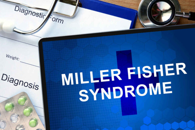 Miller Fisher syndrome diagnosis with a tablet on a wooden table.