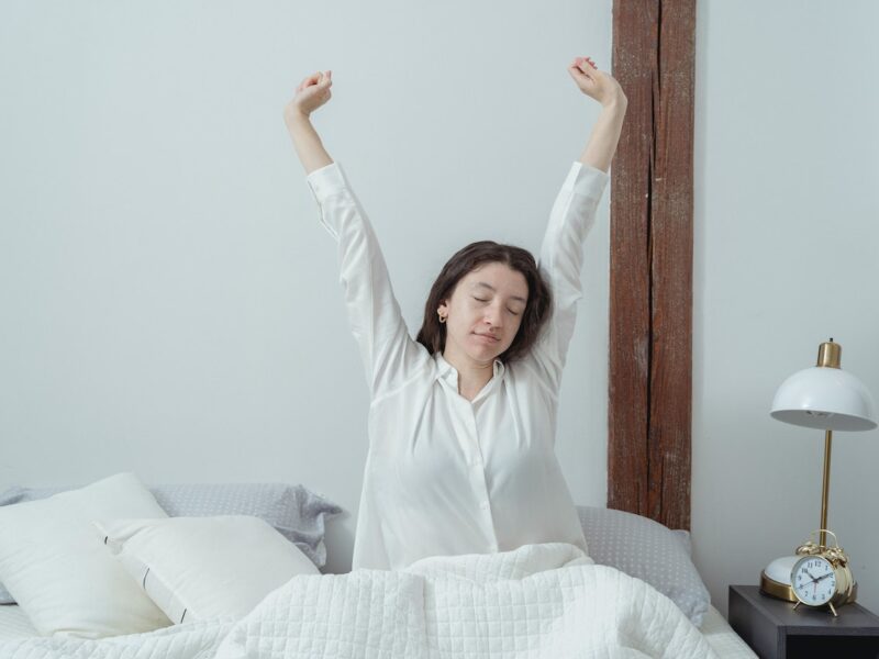 Woman in bed waking up