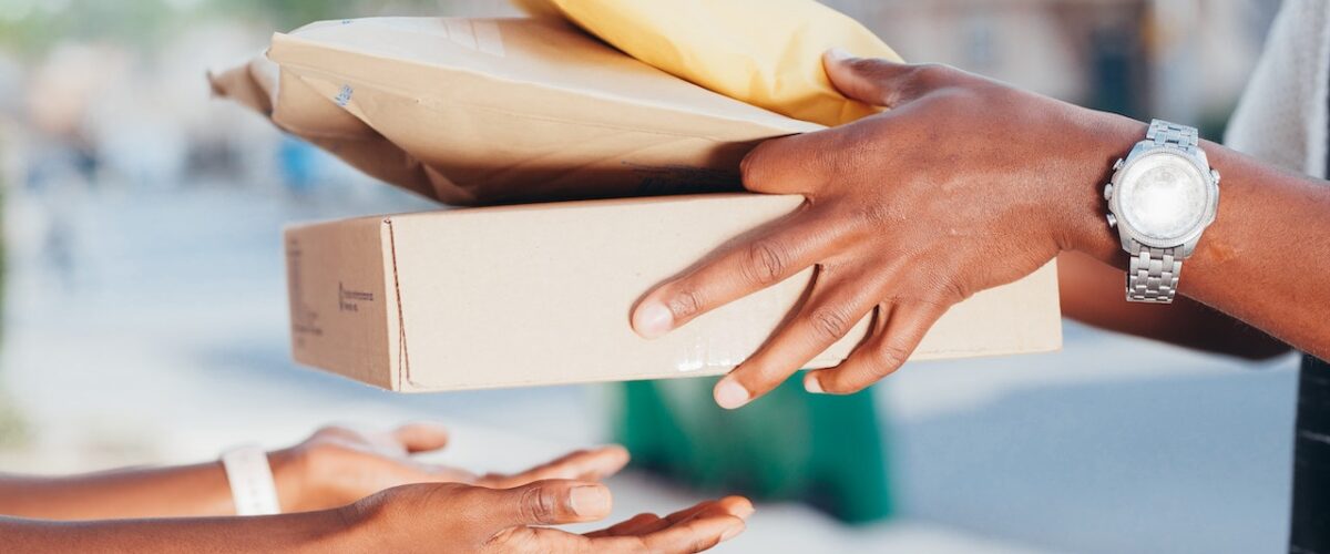 A person handing over packages