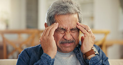 Man experiencing headaches from IVIG therapy