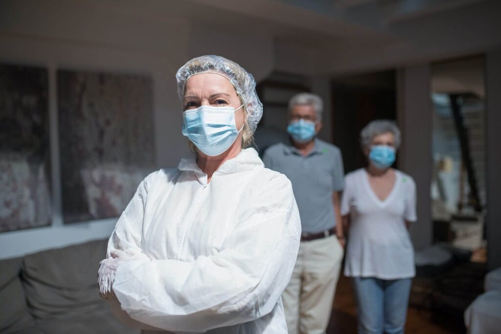 A nurse and a couple wearing masks