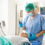 Doctor performing an intubation on a patient with myasthenic crisis