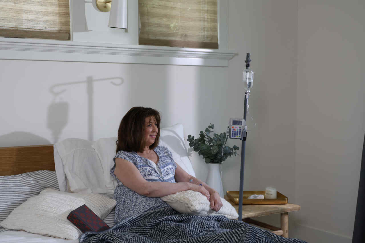 IVIG patient on bed receiving infusion.