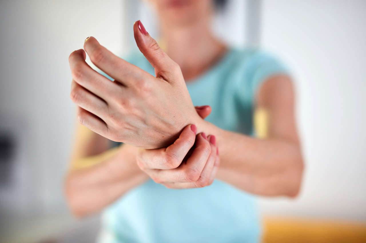 Woman with rheumatoid arthritis holding wrist