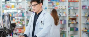 Specialty healthcare pharmacist on the phone providing consultation.