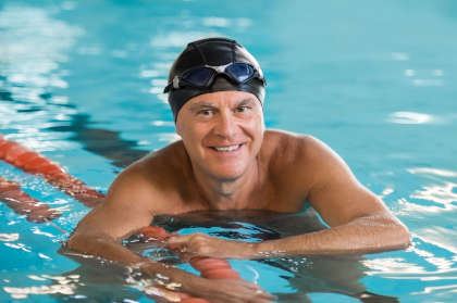 Senior man with hemophilia in a swimming pool