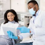 Dentist consulting with patient about hemophilia and dental treatment