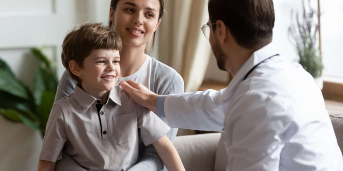 Male pediatrician seeing child with Kawasaki disease