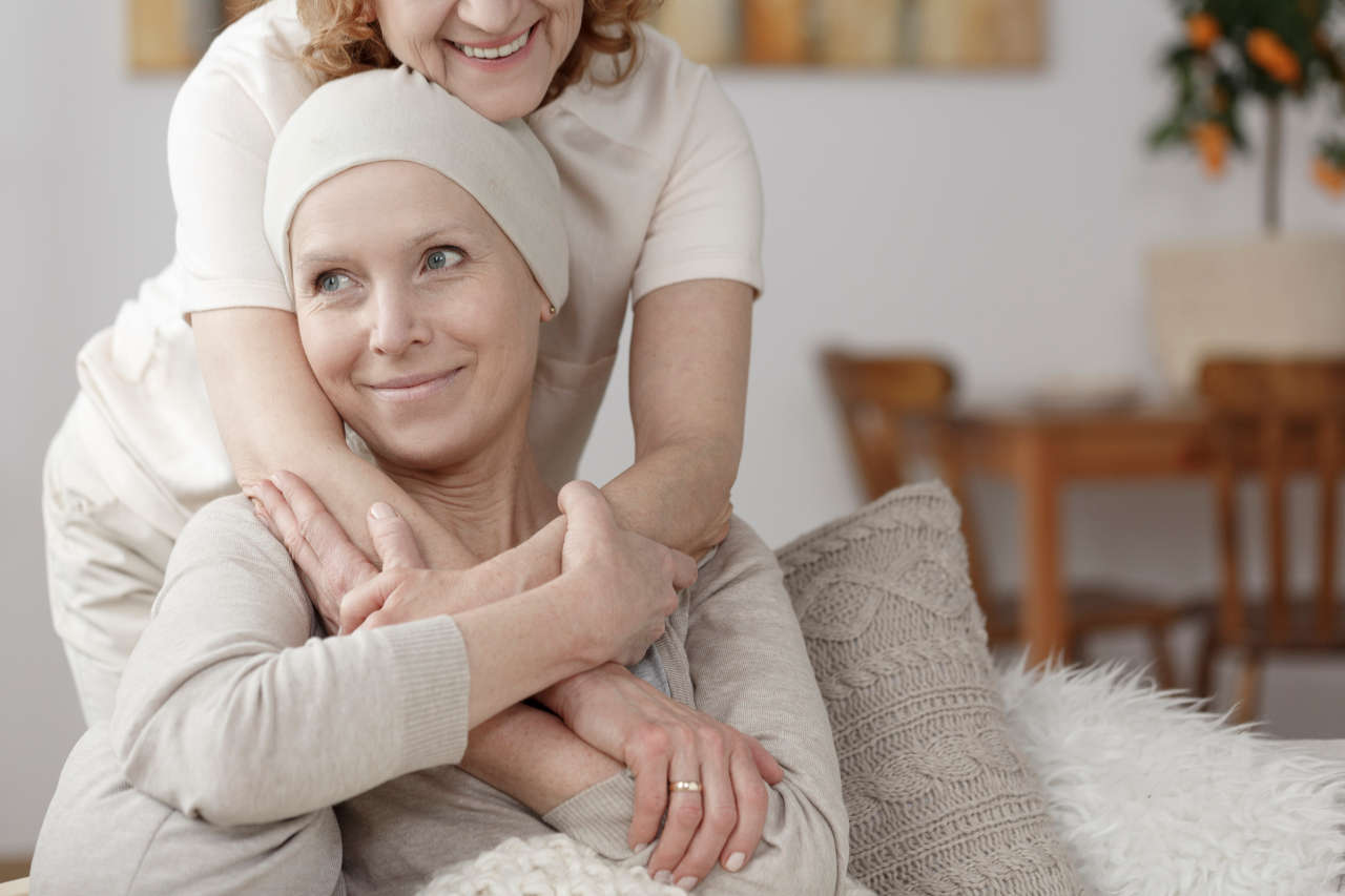 Family member supporting a woman on chemotherapy