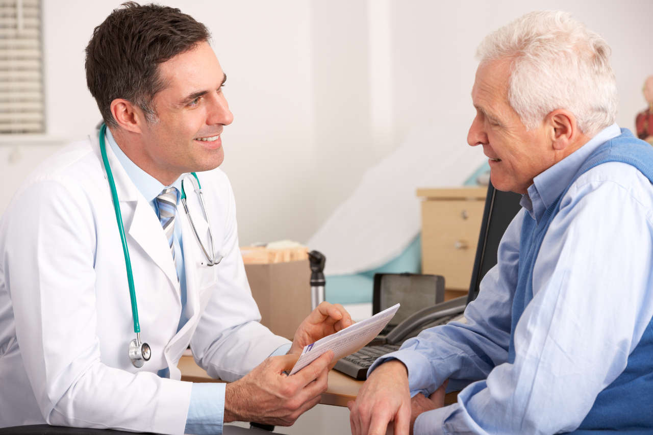 Doctor talking to senior patient about hemophilia