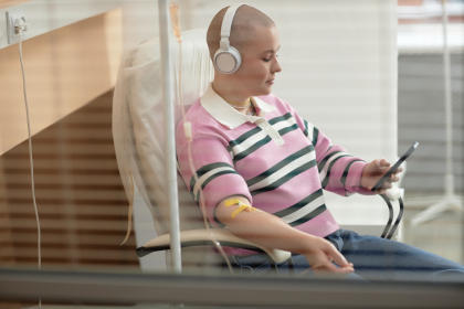 Patient in chair receiving IVIG therapy