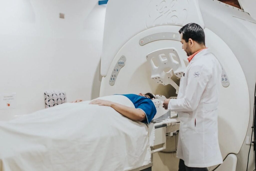 Doctor examining patient in MRI machines