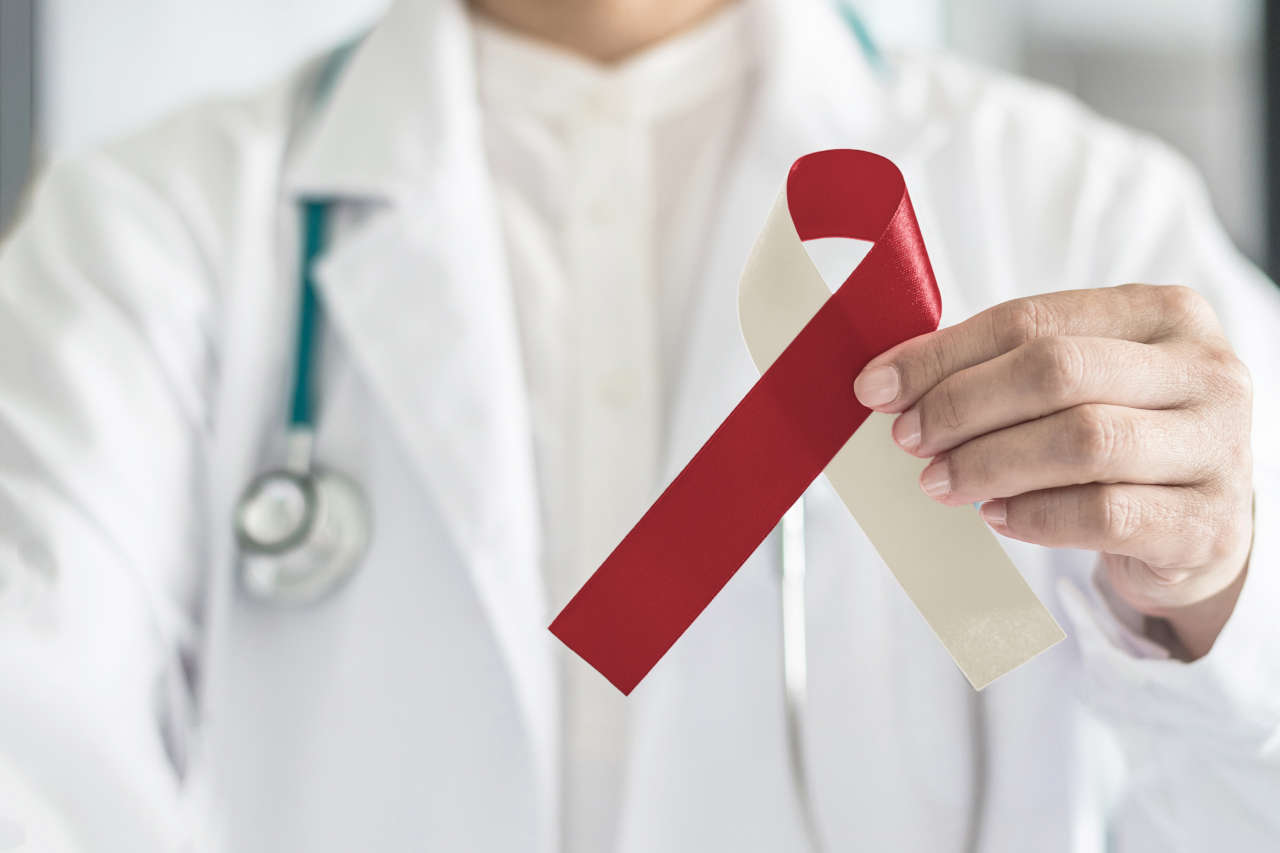 Doctor holding ribbon for head and neck cancer awareness