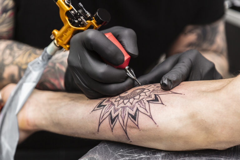 Man with hemophilia getting a tattoo