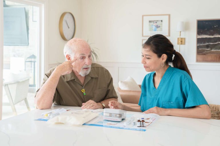 TPN nurse with patient, explaining TPN and transaminitis.