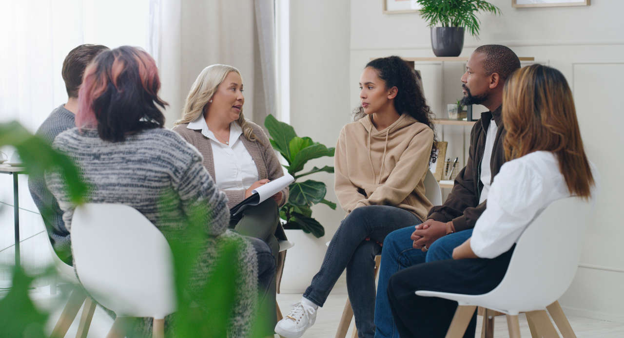 People comforting each other in a support group