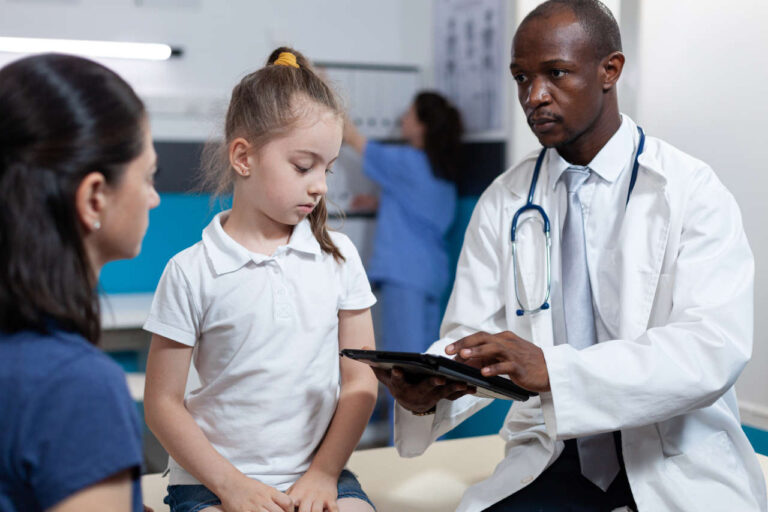 Doctor consulting with child and parent about Rasmussen encephalitis