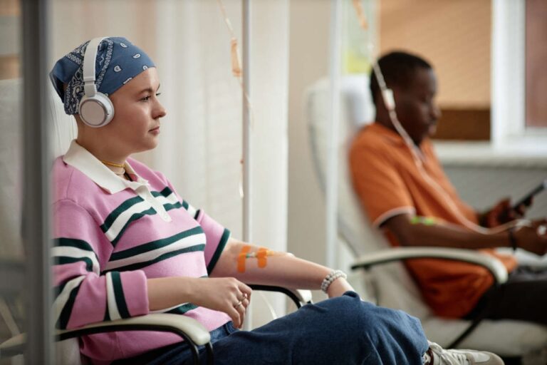 Cancer patients with headphones on receiving chemotherapy