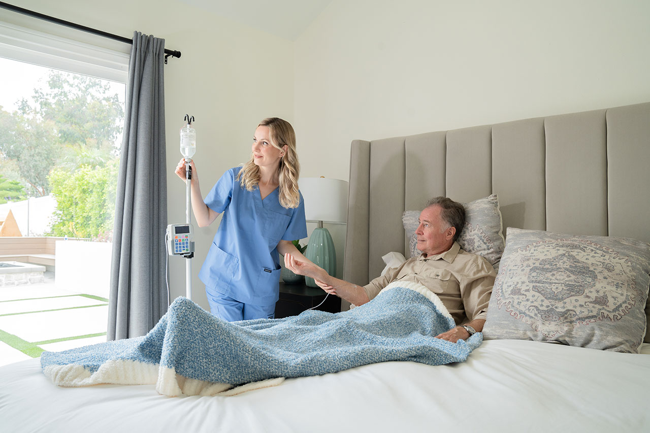 Nurse setting up IVIG for patient with toxic epidermal necrolysis