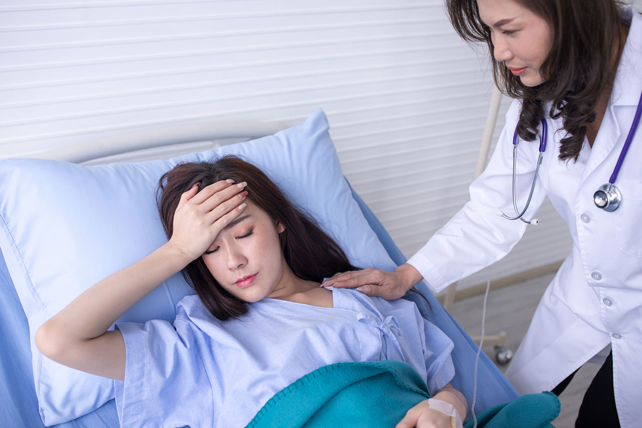 Doctor checking on a patient with post-transfusion purpura