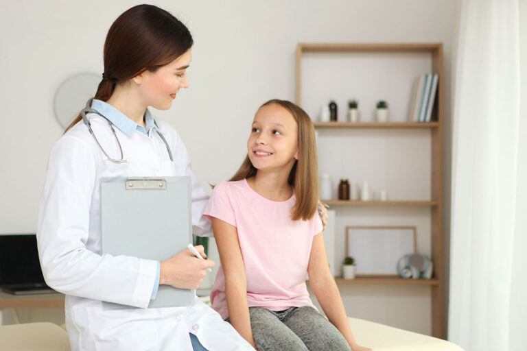 Doctor talking to a girl about IVIG for Opsoclonus-Myoclonus Syndrome (OMS)