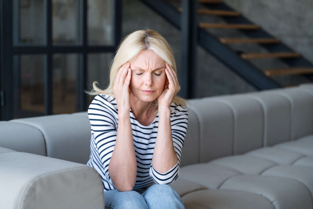A woman experiencing dizziness