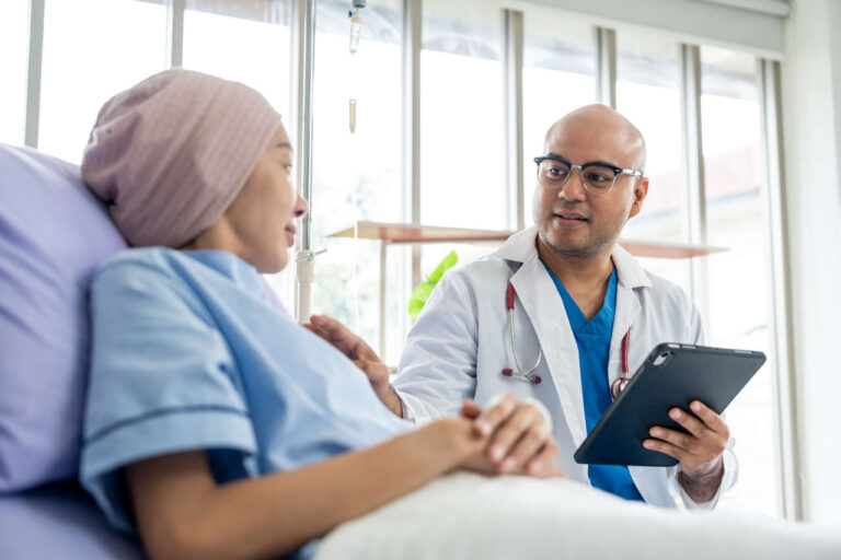 Patient in the hospital discussing Imfinzi with a doctor