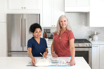 Nurse and patient setting up TPN at home