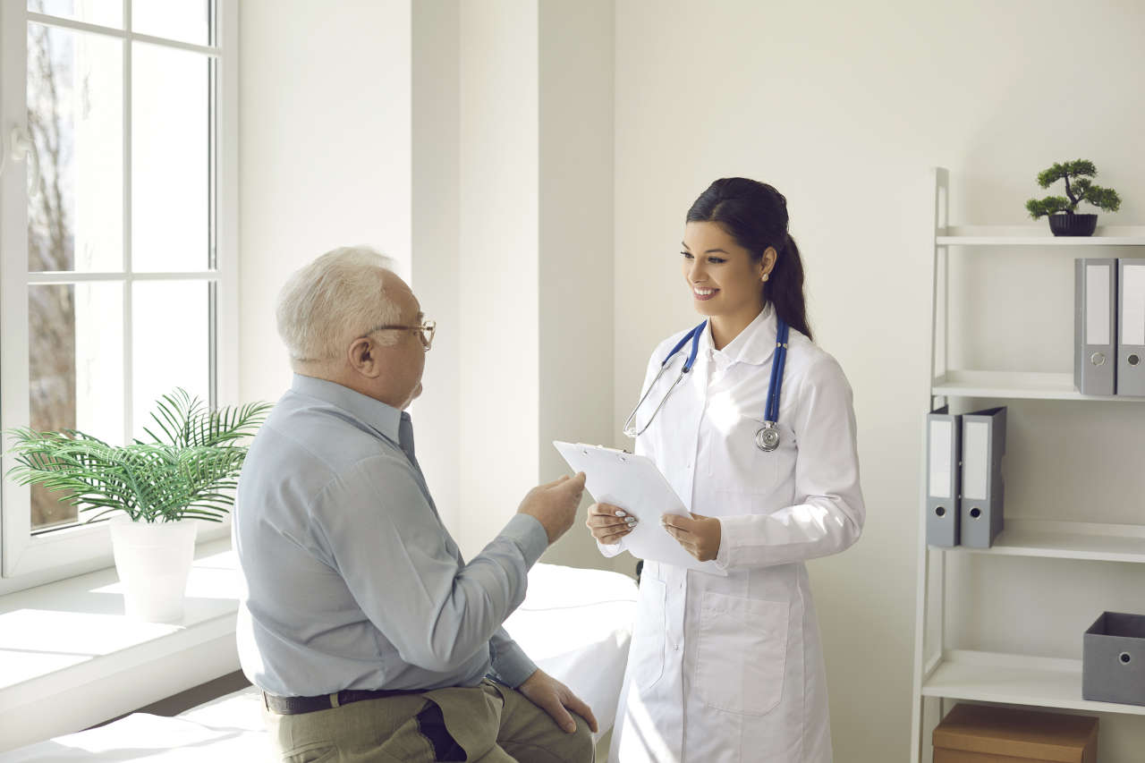 Doctor discussing vasculitis with a senior patient