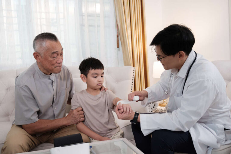 Doctor seeing a boy and parent about hemophilia and Sevenfact