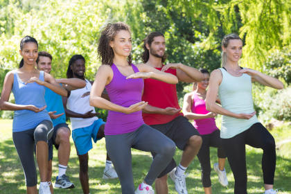 Group of women practicing tai chi in a park