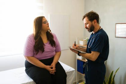 Doctor consulting with patient about obesity