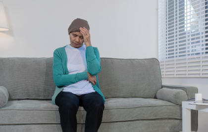 Patient on couch suffering from side effects of taking Mvasi
