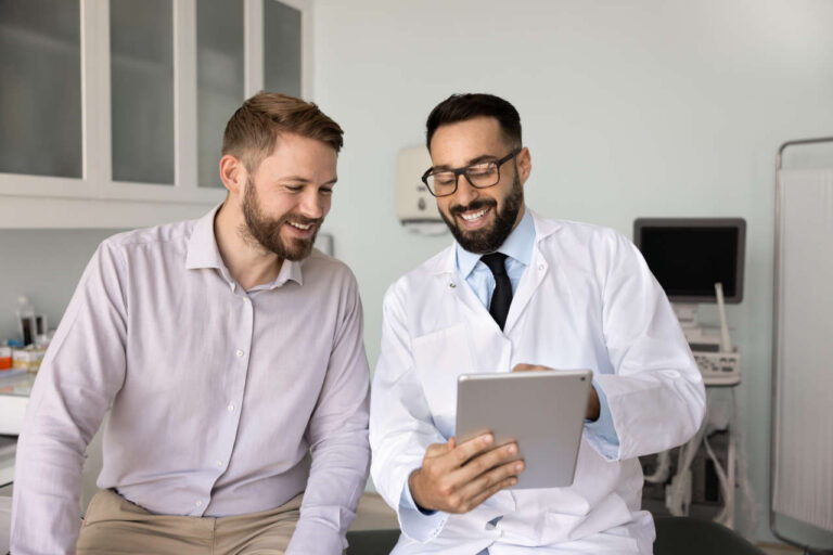 Doctor in an office talking about tolvaptan with a patient