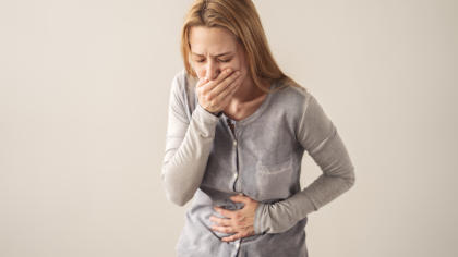 Woman experiencing nausea after taking NovoSeven