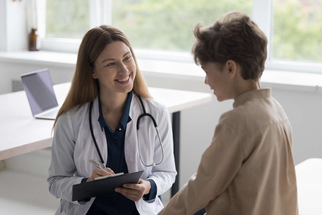 Doctor talking to boy patient about Esperoct