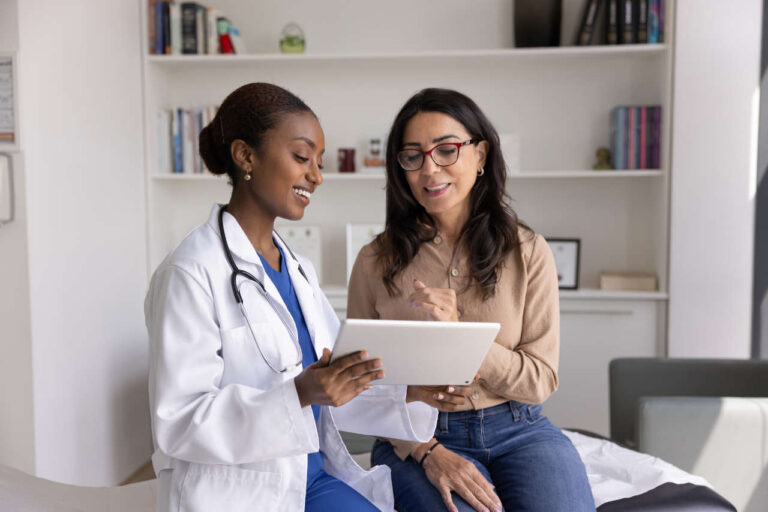 A doctor discussing Neupogen with a patient in a hospital