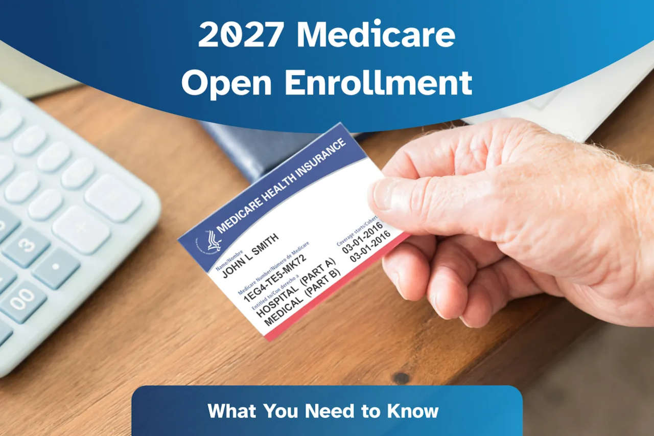 Person holding Medicare card over desk, preparing for 2027 Medicare Open Enrollment